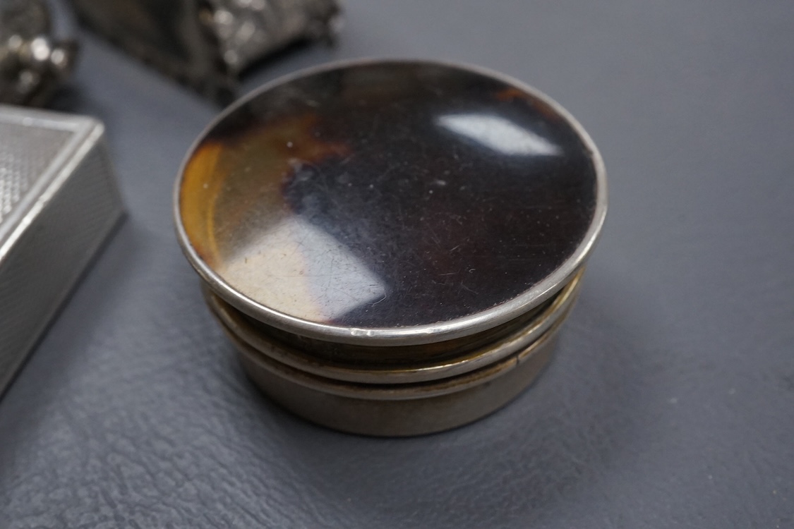 A Dunhill silver plated lighter and seven other items of collectable silver, including a modern silver caddy spoon by Pepper & Hope Ltd, a Victorian silver sovereign case, an Edwardian silver sovereign case, vesta case,